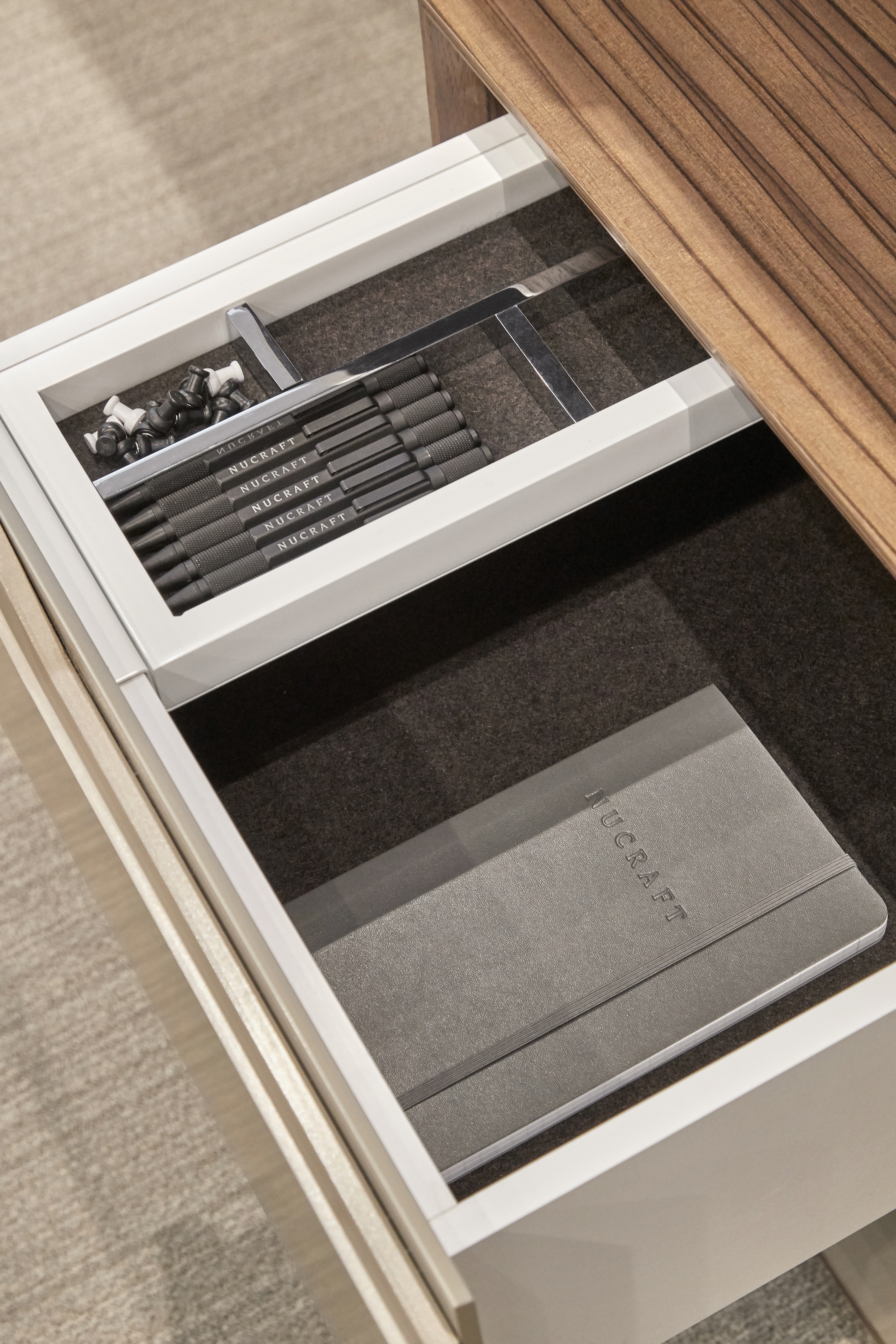Preview of Ascari | Casegood | Canyon Paldao Veneer | Burnished Painted Door Fronts | Drawer Detail | Chicago Showroom