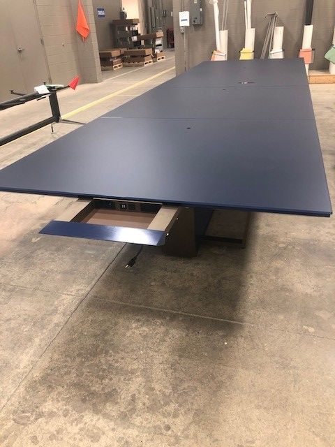 Preview of Crossbeam | Conference Table | Custom Blue Glass Top | Custom Powdercoat Base and Base Panels | Manufacturing Floor