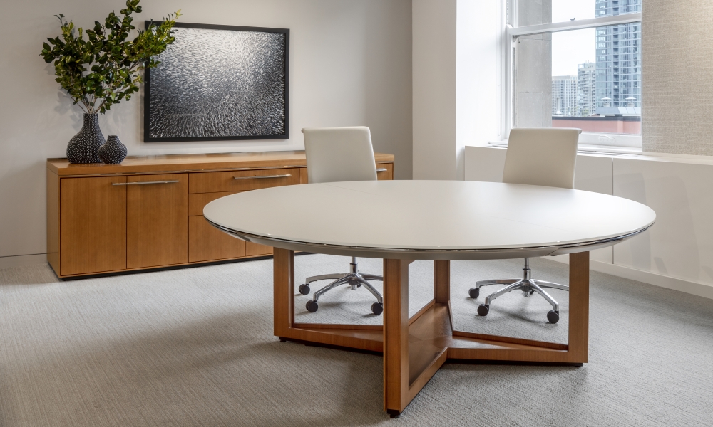 Preview of Ascari Conference and Ascari Credenza | Round Glass Table with Open X Base in veneer | Ascari Conference Height Credenza in COM veneer | Chicago Showroom