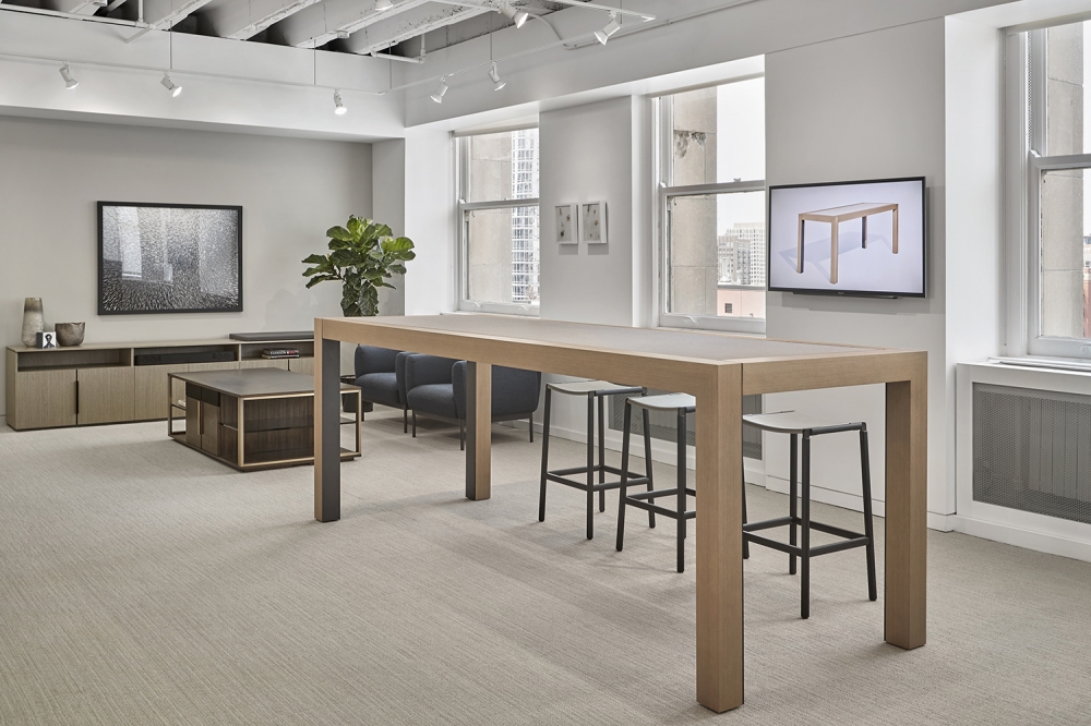 Preview of Epono | Community Table | 120” × 42” Silver Birch Linea Veneer | Felt: DesignTex, Pigment/Steel Grey | Chicago Showroom