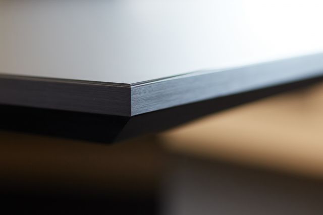 Tavola | Conference Table | Custom | Black Satin Glass Top | Black Anodized Metal | Edge Detail